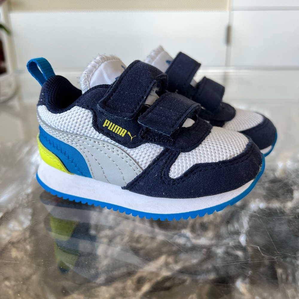 Puma baby boy sneakers size 5C. Velcro closure. White/navy/neon yellow